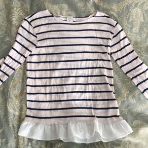 Navy striped top with ruffled hem.